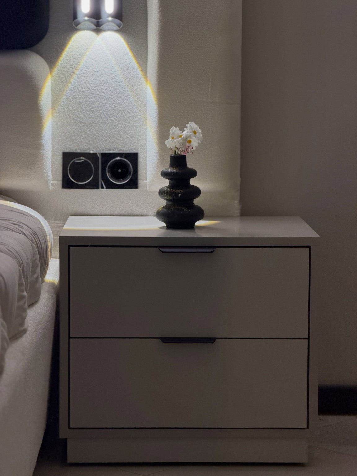 Modern white two drawer nightstand with black handles