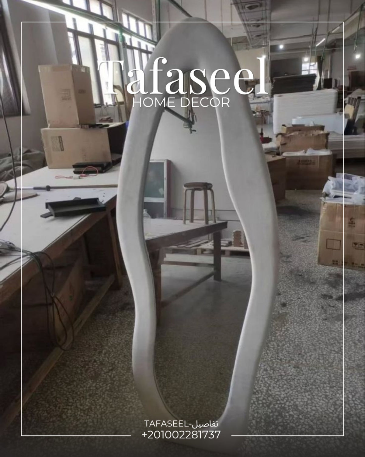 Asymmetric Cloud Mirror in white finish in workshop