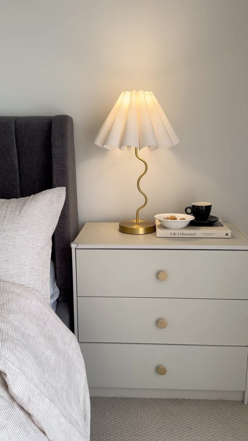 Boho Comode in a bedroom with bedside lamp by Tafaseel Home Decor